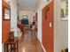 Hallway featuring hardwood floors and neutral-toned walls, providing a seamless transition between rooms at 3919 Teal Cir, Powder Springs, GA 30127