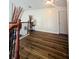Hallway with elegant wood flooring and a decorative arrangement of natural reeds at 3919 Teal Cir, Powder Springs, GA 30127
