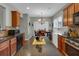 Modern eat-in kitchen with stainless steel appliances, hardwood flooring, granite counters and light gray walls at 3919 Teal Cir, Powder Springs, GA 30127