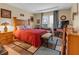 Comfortable bedroom with a decorative area rug, nightstands, and lamps at 3919 Teal Cir, Powder Springs, GA 30127