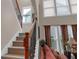 Carpeted staircase with wrought iron railings and lots of light from the windows at 3919 Teal Cir, Powder Springs, GA 30127