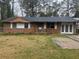 Charming brick home featuring a well-maintained lawn and a classic design at 8947 Yarmouth Dr, Jonesboro, GA 30238