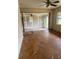 Living room with open concept connecting to the kitchen and sunroom at 8947 Yarmouth Dr, Jonesboro, GA 30238