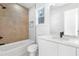 Modern bathroom features a tub with tile accent wall and a sleek vanity at 1247 Bridges Sw Ave # B, Atlanta, GA 30310