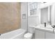 Modern bathroom featuring a bathtub, geometric tile design, and sleek vanity at 1247 Bridges Sw Ave # B, Atlanta, GA 30310
