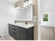 Bathroom with double vanity, sleek modern fixtures, and illuminated mirror at 1247 Bridges Sw Ave # B, Atlanta, GA 30310