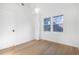 Minimalist bedroom with a neutral color scheme, natural light, and a door to the rest of the house at 1247 Bridges Sw Ave # B, Atlanta, GA 30310