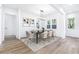 Bright dining room with contemporary lighting, a table for six, and large windows at 1247 Bridges Sw Ave # B, Atlanta, GA 30310