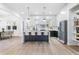 Modern kitchen features a large island, stainless steel appliances, and pendant lighting at 1247 Bridges Sw Ave # B, Atlanta, GA 30310