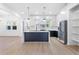 Open kitchen with a large island, modern appliances, and plenty of natural light from the windows at 1247 Bridges Sw Ave # B, Atlanta, GA 30310