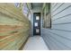 Side entrance featuring a modern door with glass panels and a view of the home's exterior at 1247 Bridges Sw Ave # B, Atlanta, GA 30310