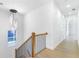 Staircase with modern railings, a pendant light fixture, and access to upper level rooms at 1247 Bridges Sw Ave # B, Atlanta, GA 30310