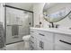 Elegant bathroom features a modern vanity, a stylish mirror, and a glass-enclosed shower with sleek fixtures at 1677 Foresta Ct, Atlanta, GA 30341