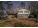 Charming two-story home featuring a brick facade, blue shutters, and a well-maintained front yard at 1677 Foresta Ct, Atlanta, GA 30341