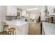 Open-concept kitchen featuring white countertops, stainless steel appliances, and a cozy sitting area at 1677 Foresta Ct, Atlanta, GA 30341