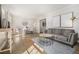 Bright living room featuring hardwood floors, neutral decor, and ample natural light at 1677 Foresta Ct, Atlanta, GA 30341