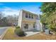 View of the backyard featuring a patio, siding, and a sliding glass door in a well-maintained outdoor space at 4645 Valais Ct # 135, Alpharetta, GA 30022