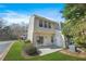 Home's backyard featuring a lawn, patio, and trees at 4645 Valais Ct # 135, Alpharetta, GA 30022