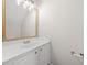 Clean bathroom featuring white vanity and a gold framed mirror, creating a bright ambiance at 4645 Valais Ct # 135, Alpharetta, GA 30022