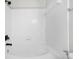 Bright bathroom featuring a tub with black hardware and clean white tile at 4645 Valais Ct # 135, Alpharetta, GA 30022