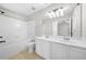 Clean and functional bathroom featuring a shower-tub, double sinks, and ample counter space at 4645 Valais Ct # 135, Alpharetta, GA 30022