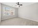 Bedroom with carpet, ceiling fan, and bright window at 4645 Valais Ct # 135, Alpharetta, GA 30022