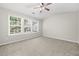 Spacious bedroom with large windows and plush carpet flooring. Natural light floods the room at 4645 Valais Ct # 135, Alpharetta, GA 30022