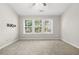 Inviting bedroom featuring plush carpet, bright windows, and ample space at 4645 Valais Ct # 135, Alpharetta, GA 30022
