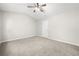 Cozy bedroom with neutral carpet, ceiling fan, and bright natural lighting at 4645 Valais Ct # 135, Alpharetta, GA 30022