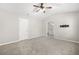 Large bedroom featuring plush carpeting, ceiling fan, and access to an ensuite bathroom at 4645 Valais Ct # 135, Alpharetta, GA 30022