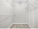 Walk-in closet with carpeted floor and wire shelving at 4645 Valais Ct # 135, Alpharetta, GA 30022