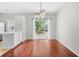 Bright dining area with hardwood floors, stylish lighting, and sliding door access to the yard at 4645 Valais Ct # 135, Alpharetta, GA 30022