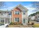 Charming brick and siding townhome with a well-manicured front yard and a welcoming entrance at 4645 Valais Ct # 135, Alpharetta, GA 30022