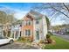 Inviting two-story townhome with brick and siding, complemented by lush landscaping and dedicated parking at 4645 Valais Ct # 135, Alpharetta, GA 30022
