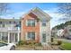 Charming brick and siding townhome with a well-manicured front yard and a welcoming entrance at 4645 Valais Ct # 135, Alpharetta, GA 30022