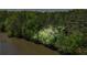 Aerial view of a home on a lake surrounded by mature trees at 4811 West Lake Se Dr, Conyers, GA 30094