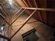 Attic with wooden beams, partial flooring, and natural light, offering expansion possibilities at 4811 West Lake Se Dr, Conyers, GA 30094