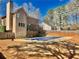 Exterior of home shows backyard, deck, patio and covered pool at 4811 West Lake Se Dr, Conyers, GA 30094