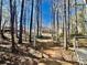 Back of house as seen from lake with path and wooden deck at 4811 West Lake Se Dr, Conyers, GA 30094
