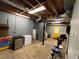 Unfinished basement providing ample storage space, a utility area, and a bright yellow door at 4811 West Lake Se Dr, Conyers, GA 30094