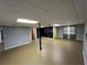 Basement with finished walls, support beam, and walk-out door at 4811 West Lake Se Dr, Conyers, GA 30094