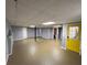 Basement with yellow exterior door and finished walls at 4811 West Lake Se Dr, Conyers, GA 30094