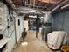 Spacious unfinished basement featuring exposed ductwork and mechanicals with room for storage at 4811 West Lake Se Dr, Conyers, GA 30094
