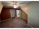 View of bedroom with neutral carpet and a closet with rod and shelving at 4811 West Lake Se Dr, Conyers, GA 30094