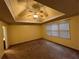 Bedroom with tray ceiling, recessed lighting, neutral carpet and lots of natural light at 4811 West Lake Se Dr, Conyers, GA 30094