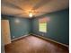 A blue painted bedroom with a neutral carpet and lots of natural light at 4811 West Lake Se Dr, Conyers, GA 30094