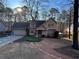 Well-maintained home with an attached garage and beautifully landscaped front yard at 4811 West Lake Se Dr, Conyers, GA 30094