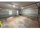 Open two-car garage with an access door and natural light from a nearby window at 4811 West Lake Se Dr, Conyers, GA 30094