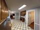 Kitchen featuring beautiful wood cabinets and checkered floors at 4811 West Lake Se Dr, Conyers, GA 30094