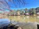 View from the dock of the lake and treed property shoreline at 4811 West Lake Se Dr, Conyers, GA 30094